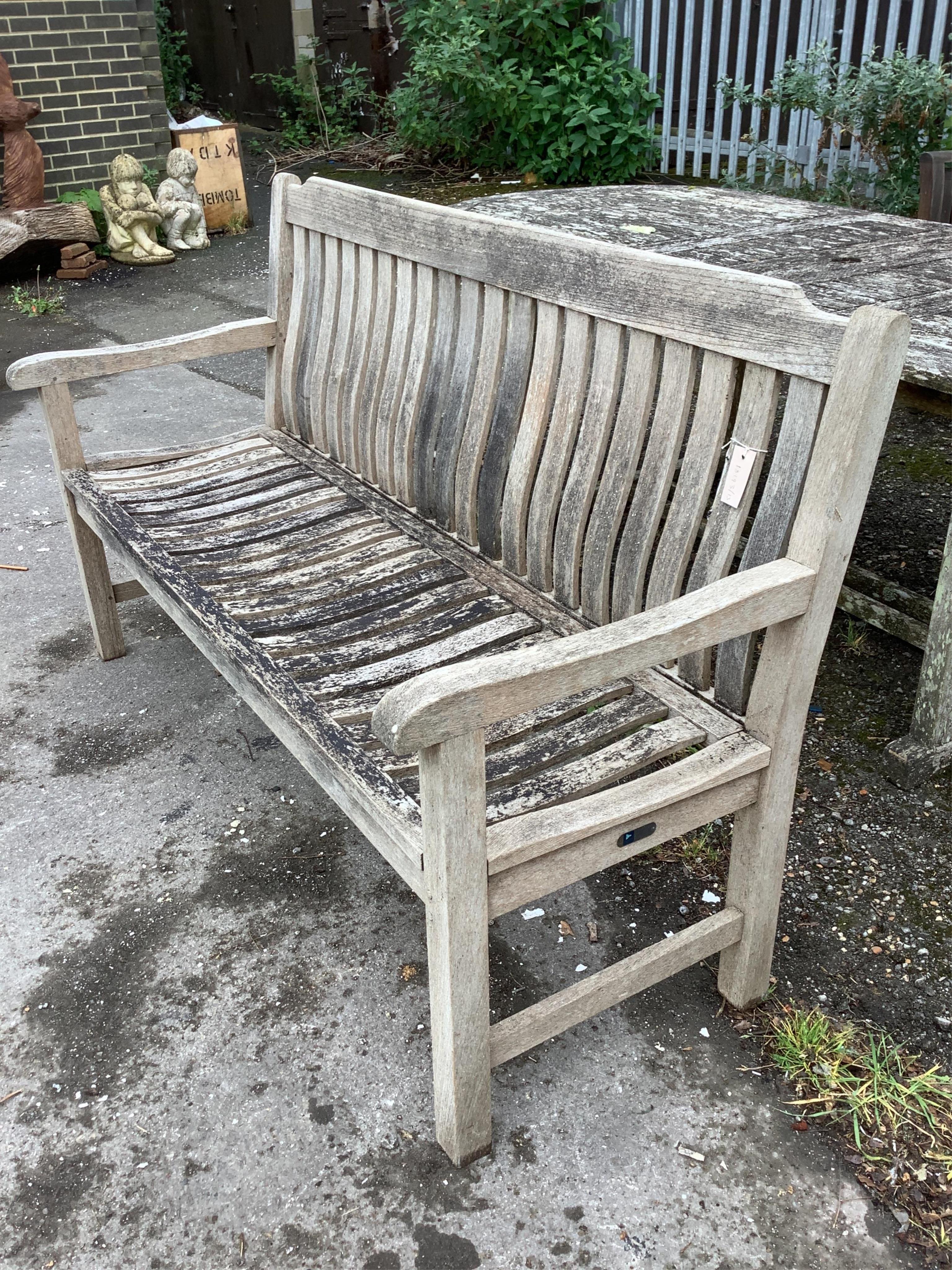 A weathered teak slatted garden bench by Neptune,width 154cm, depth 58cm, height 92cm